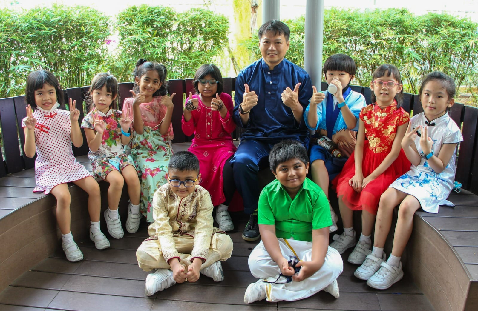 Showcase students wearing Cheongsam, the Baju Kurung and Saree